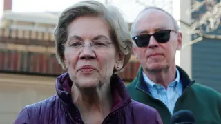 Democratic U.S. presidential candidate Warren talks to reporters in Cambridge