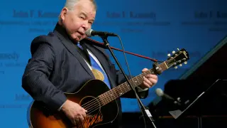 FILE PHOTO: Musician John Prine performs after accepting his PEN New England Song Lyrics of Literary Excellence Award during a ceremony at the John F. Kennedy Library in Boston