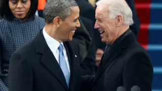FILE PHOTO: U.S. President Barack Obama is greeted by Vice President Biden as he arrives for his swearing-in ceremonies on the West Front of the U.S. Capitol in Washington