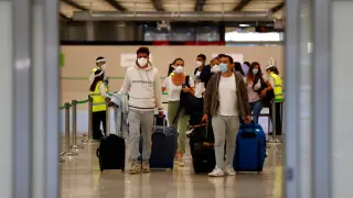 Passengers arrive at Adolfo Suarez Barajas airport in Madrid