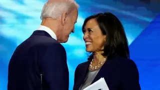 FILE PHOTO: Former Vice President Biden talks with Senator Harris after the conclusion of the 2020 Democratic U.S. presidential debate in Houston