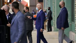 Joe Biden walks to his motorcade vehicle in Wilmington, Delaware
