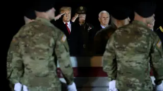 FILE PHOTO: U.S. President Donald Trump salutes the transfer case holding the remains of U.S. Army soldier Sergeant Gutierrez during a dignified transfer at Dover Air Force Base, in Dover, Delaware