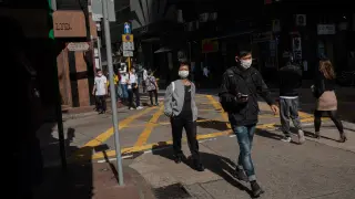 People wear masks in Hong Kong.