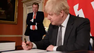 Britain's Prime Minister Boris Johnson signs the Brexit trade deal with EU