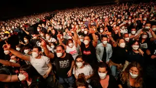 People wearing protective masks attend a concert of Love HEALTH-CORONAVIRUS/SPAIN- CONCERT