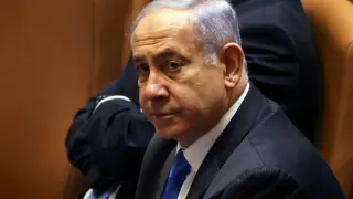 Israeli Prime Minister Benjamin Netanyahu looks on during a special session of the Knesset, Israel's parliament, whereby a confidence vote will be held to approve and swear-in a new coalition government, in Jerusalem