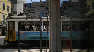 People sit inside a tram in downtown Lisbon amid the coronavirus disease (COVID-19) pandemic, in Lisbon
