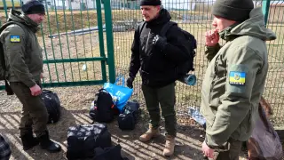 FILE PHOTO: Estonian citizens from Tallinn gather before crossing the border from Poland to Ukraine to join as foreign fighter at the front line in Ukraine following Russia's invasion, at the border checkpoint in Medyka