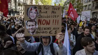 People hold placards during a demonstration against far-right, racism and fascism ahead of the second round of the 2022 presidential election, in Paris, France, April 16, 2022. REUTERS/Sarah Meyssonnier FRANCE-ELECTION/PROTEST
