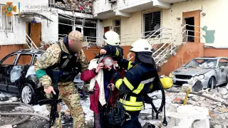 Emergency service workers rescue people after a missile strike, as Russia's invasion of Ukraine continues, in Odesa Oblast