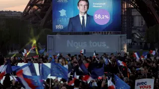FILE PHOTO: Supporters of President Emmanuel Macron wave French and European Union flags in reaction to his election victory, in Paris, France