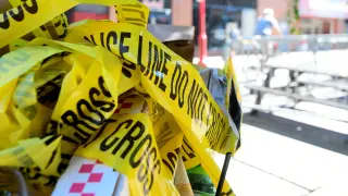 FILE PHOTO: Police tape is trashed at the scene of a shooting in Philadelphia