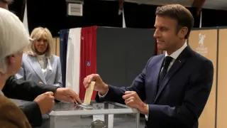 French President Macron casts his ballot during the final round of the country's parliamentary elections, in Le Touquet