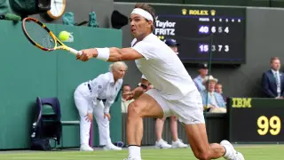 Tennis - Wimbledon - All England Lawn Tennis and Croquet Club, London, Britain - July 6, 2022 Spain's Rafael Nadal reacts during his quarter final match against Taylor Fritz of the U.S. REUTERS/Hannah Mckay TENNIS-WIMBLEDON/