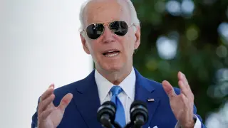 U.S. President Joe Biden speaks before signing two bills aimed at combating fraud in the COVID-19 small business relief programs