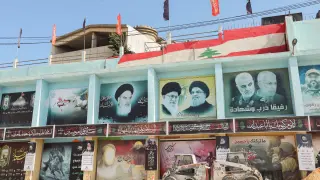 A picture showing Lebanon's Hezbollah leader Sayyed Hassan Nasrallah and Iran's Supreme Leader Ayatollah Ali Khamenei is seen in the town of Yaroun