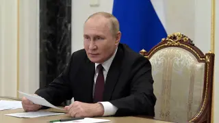 Russian President Putin addresses heads of security agencies of CIS states via video link in Moscow