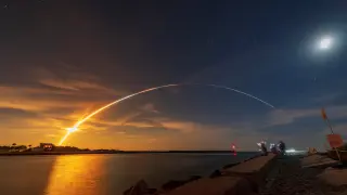NASA's next-generation moon rocket, the Space Launch System (SLS) rocket with the Orion crew capsule, lifts off from launch complex 39-B, seen from Sebastian