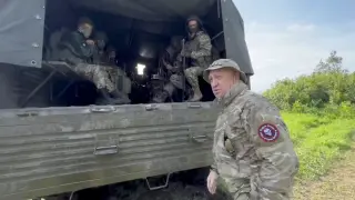 Founder of Wagner private mercenary group Yevgeny Prigozhin speaks with servicemen during withdrawal of his forces from Bakhmut and handing over their positions to regular Russian troops, in the course of Russia-Ukraine conflict in an unidentified location, Russian-controlled Ukraine, in this still image taken from video released June 1, 2023. Press service of "Concord"/Handout via REUTERS ATTENTION EDITORS - THIS IMAGE WAS PROVIDED BY A THIRD PARTY. NO RESALES. NO ARCHIVES. MANDATORY CREDIT.