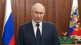 In this handout photo taken from video released by Russian Presidential Press Service, Russian President Vladimir Putin addresses to the nation in Moscow, Russia, on Monday, June 26, 2023. (Russian Presidential Press Service via AP)