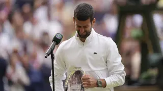Serbia's Novak Djokovic cries after losing to Spain's Carlos Alcaraz in the men's singles final on day fourteen of the Wimbledon tennis championships in London, Sunday, July 16, 2023. (AP Photo/Alberto Pezzali)