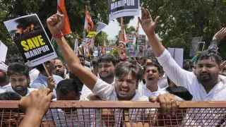 Members of the youth wing of India's Congress party shout slogans during a protest near Parliament House in New Delhi, India, Thursday, July 20, 2023. The protest was against deadly ethnic clashes in the country's northeast after a video showed two women being assaulted by a mob. The video triggered outrage across India and was widely shared on social media despite the internet being largely blocked in remote Manipur state. (AP Photo/Manish Swarup)
