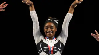 Simone Biles poses during the awards ceremony after winning the all-around of the Core Hydration Classic