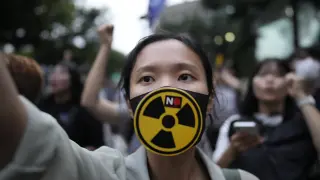 A member of environmental civic group shouts slogan during a rally to demand the withdrawal of the Japanese government's decision to release treated radioactive water into the sea from the damaged Fukushima nuclear power plant, in Seoul, South Korea, Tuesday, Aug. 22, 2023. Japan will start releasing treated and diluted radioactive wastewater from the Fukushima Daiichi nuclear plant into the Pacific Ocean as early as Thursday — a controversial step that the government says is essential for the decades of work needed to shut down the facility that had reactor meltdowns 12 years ago. (AP Photo/Lee Jin-man)