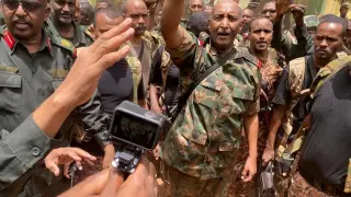 FILE PHOTO: Sudan's General Abdel Fattah al-Burhan stands among troops,in an unknown location, in this picture released on May 30, 2023. Sudanese Armed Forces/Handout via REUTERS THIS IMAGE HAS BEEN SUPPLIED BY A THIRD PARTY. MANDATORY CREDIT/File Photo