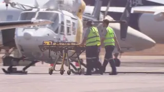 Paramedics push a stretcher following U.S. military aircraft crash in Darwin, Australia, August 27, 2023 in this screen grab obtained from a handout video. AUSTRALIAN BROADCASTING CORPORATION/via Reuters TV/Handout via REUTERS THIS IMAGE HAS BEEN SUPPLIED BY A THIRD PARTY. AUSTRALIA OUT. NO COMMERCIAL OR EDITORIAL SALES IN AUSTRALIA. NO USE AUSTRALIA/ANY INTERNET SITE OF ANY AUSTRALIA BASED MEDIA ORGANISATIONS OR MOBILE PLATFORMS.