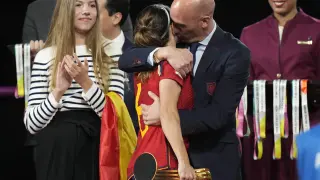 FILE - President of Spain's soccer federation, Luis Rubiales, right, hugs Spain's Aitana Bonmati on the podium following Spain's win in the final of Women's World Cup soccer against England at Stadium Australia in Sydney, Australia, Sunday, Aug. 20, 2023. Rubiales has resigned, Sunday, Sept. 10, 2023, from his post after a kiss scandal which tarnished Spain's victory at the Women's World Cup. (AP Photo/Alessandra Tarantino, file)