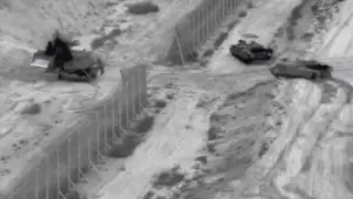 Israeli armoured vehicles take part in an operation, as the conflict between Israel and Hamas continues, at a location given as the northern Gaza Strip in this still image taken from handout video released October 26, 2023. Israel Defense Forces/Handout via REUTERS THIS IMAGE HAS BEEN SUPPLIED BY A THIRD PARTY