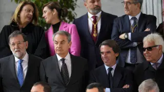 Former Spanish prime ministers Mariano Rajoy, Jose Luis Rodriguez Zapatero, José María Aznar and Felipe Gonzalez, from left to right, stand outside the Spanish parliament during a parade, following the swearing allegia
