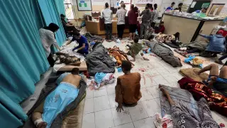 Palestinians wounded in Israeli strikes are assisted at the Indonesian hospital