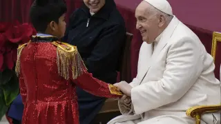 Pope Francis is greets a young performer as he celebrates his birthday with children assisted by the Santa Marta dispensary during an audience in the Paul VI Hall, at the Vatican, Sunday, Dec. 17, 2023. Pope Francis turnes 87 on Dec.17. (AP Photo/Alessandra Tarantino) Associated Press/LaPresse Only Italy and Spain