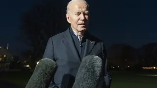 FILE - President Joe Biden answers a reporter's question as he walks from Marine One upon arrival on the South Lawn of the White House, Dec. 20, 2023, in Washington. Biden ordered retaliatory strikes Monday, Dec. 25, against Iranian-backed militia groups after three U.S. servicemembers were injured in a drone attack in Northern Iraq. (AP Photo/Alex Brandon, File)