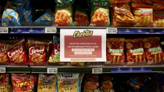 A sign reading We are no longer selling this brand due to unacceptable price increases. We apologize for the inconvenience caused. is seen on a shelf for PepsiCo product Cheetos at a Carrefour hypermarket in Paris, France, January 4, 2024. REUTERS/Stephanie Lecocq [[[REUTERS VOCENTO]]]