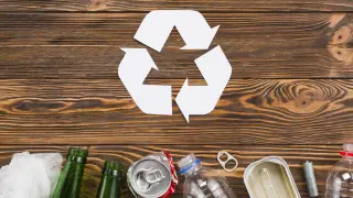 recycling-icon-trash-wooden-background