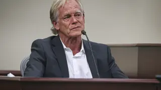 A teary-eyed David Halls, former first assistant director on "Rust," takes a moment to collect himself after recounting the moments following the fatal shooting of cinematographer Halyna Hutchins during a 2021 rehearsal, while testifying during Hannah Gutierrez-Reed's involuntary manslaughter trial in state district court in Santa Fe, N.M., Thursday, Feb. 29, 2024. (Gabriela Campos/Santa Fe New Mexican via AP, Pool)