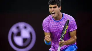 Carlos Alcaraz, of Spain, reacts after scoring a point against Matteo Arnaldi, of Italy, at the BNP Paribas Open tennis tournament in Indian Wells, Calif., Friday, March 8, 2024. (AP Photo/Ryan Sun)