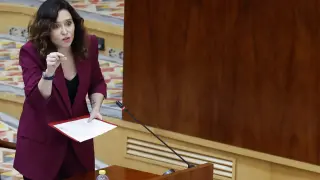 La presidenta de la Comunidad de Madrid, Isabel Díaz Ayuso, interviene en el pleno de la Asamblea de Madrid, este jueves.
