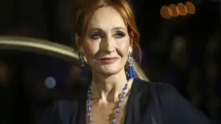 FILE - J.K. Rowling poses for photographers upon her arrival at the premiere of the film 'Fantastic Beasts: The Crimes of Grindelwald', in London, Nov. 13, 2018. Police say J.K. Rowling didn't break the law with tweets criticizing Scotland’s new hate speech law and referring to transgender women as men. (Photo by Joel C Ryan/Invision/AP, File)