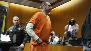 James Crumbley is escorted out of court after his sentencing, Tuesday, April 9, 2024, in Pontiac, Mich. James and Jennifer Crumbley, the parents of a Michigan school shooter, were sentenced to at least 10 years in prison Tuesday for failing to take steps that could have prevented the killing of four students in 2021. (AP Photo/Carlos Osorio)