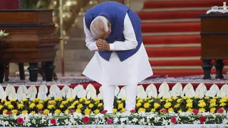 India's Prime Minister Narendra Modi bows before taking an oath during a swearing-in ceremony at the presidential palace, in New Delhi