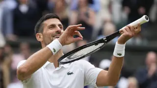 Novak Djokovic of Serbia reacts after defeating Lorenzo Musetti of Italy in their semifinal match at the Wimbledon tennis championships in London, Friday, July 12, 2024.(AP Photo/Kirsty Wigglesworth)