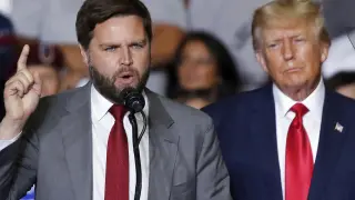 FILE - Republican Ohio Senate candidate JD Vance speaks as Republican presidential candidate former President Donald Trump listens at a campaign rally in Youngstown, Ohio., Sept. 17, 2022. Trump says Vance will be his vice presidential pick for 2024. He says on his Truth Social Network that, “After lengthy deliberation and thought, and considering the tremendous talents of many others, I have decided that the person best suited to assume the position of Vice President of the United States is Senator J.D. Vance of the Great State of Ohio.” (AP Photo/Tom E. Puskar, File)
