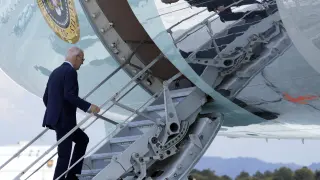 President Joe Biden walks up the steps of Air Force One at Harry Reid International Airport in Las Vegas, Wednesday, July 17, 2024. Biden has tested positive for the coronavirus, according to a speaker at the UnidosUS annual conference broadcast on the White House's YouTube channel. (AP Photo/Susan Walsh)