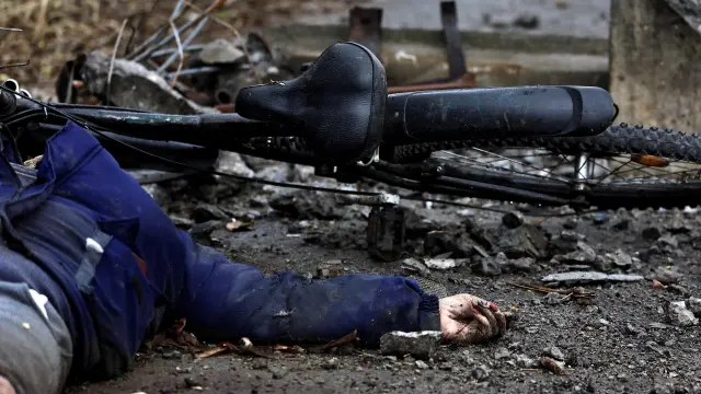 Body of a woman lies on the street, amid Russia invasion on Ukraine, in Bucha