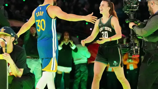 Feb 17, 2024; Indianapolis, IN, USA; Golden State Warriors guard Stephen Curry (30) and New York Liberty guard Sabrina Ionescu (20) after the Stephen vs Sebrina three-point challenge during NBA All Star Saturday Night at Lucas Oil Stadium. Mandatory Credit [[[REUTERS VOCENTO]]]